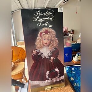 Charisse Holiday Porcelain Animated Doll with Burgundy Dress